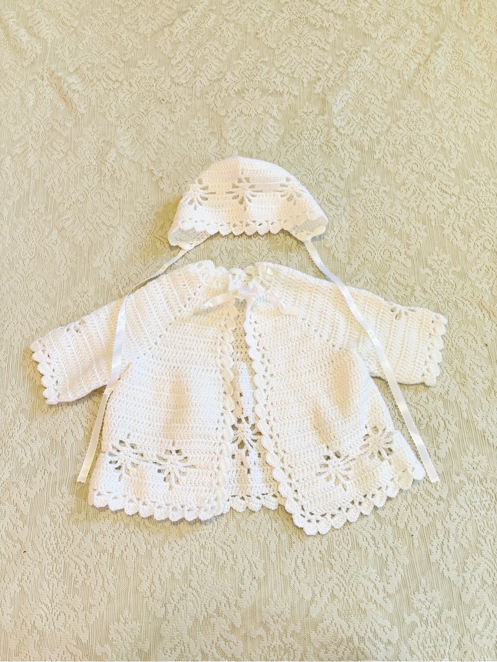 Handmade scalloped edge knit baby sweater and bonnet